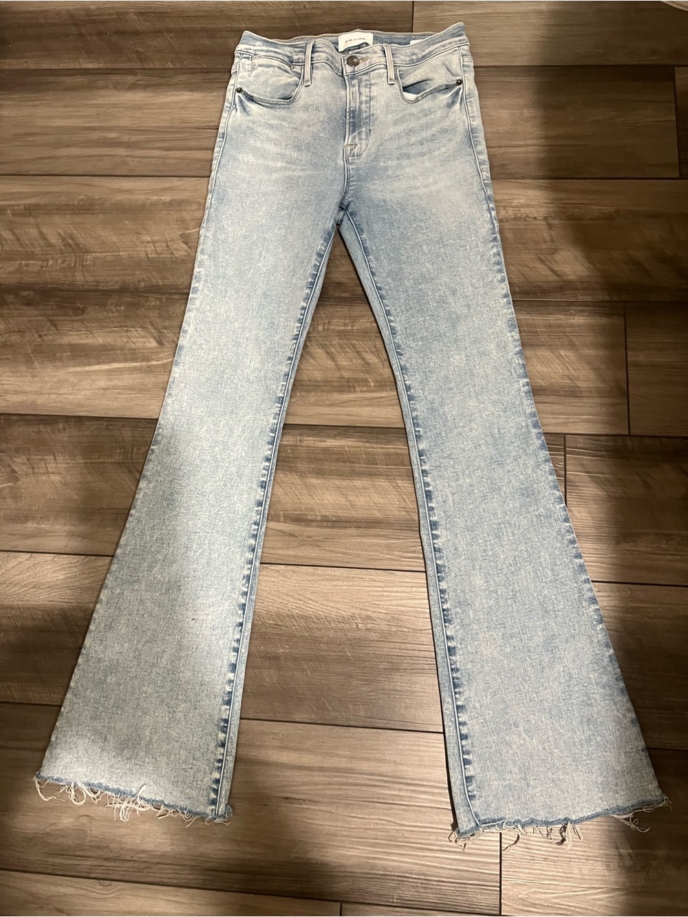 Frame Denim Light Blue Flared Jeans with Raw Hem